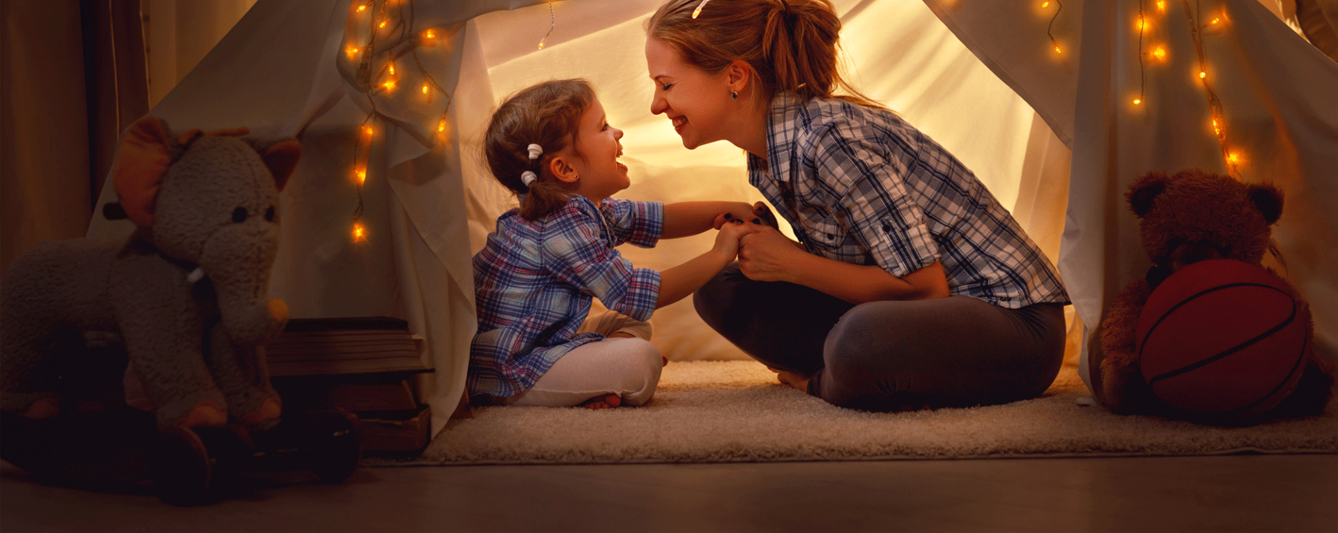 Mother and daughter smiling